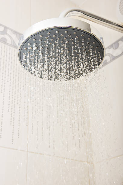 istock shower head with drops and streams of water 187674601