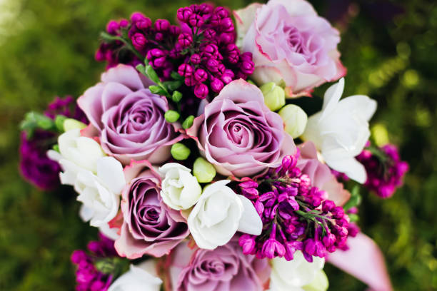 istock bouquet of roses and lilacs 1876758606