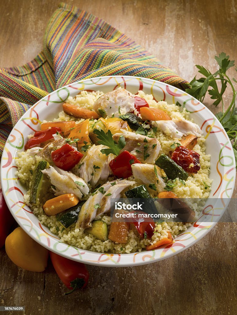 couscous with fish and vegetables couscous with fish and vegetables, typical moroccan recipe Couscous Stock Photo