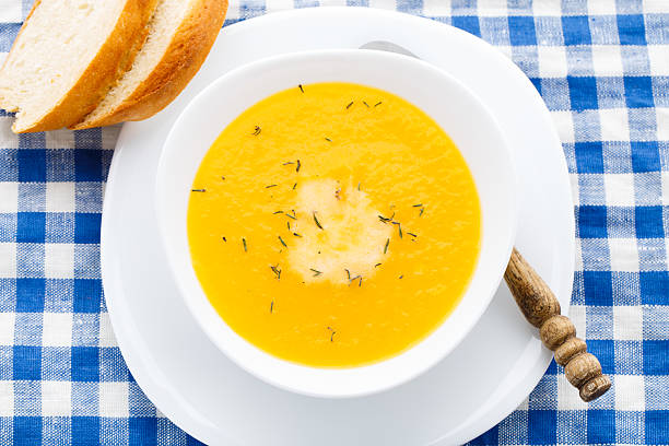 istock Pumpkin soup in white bowl 187676420