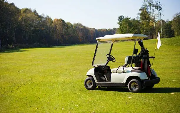 Golf-cart car on golf course landscape