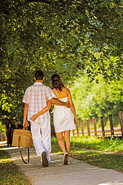 istock Couple walking in the park 187676493