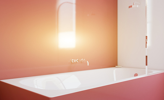 Freestanding bath with towels in grey modern bathroom. 3D rendering.. Sunset.