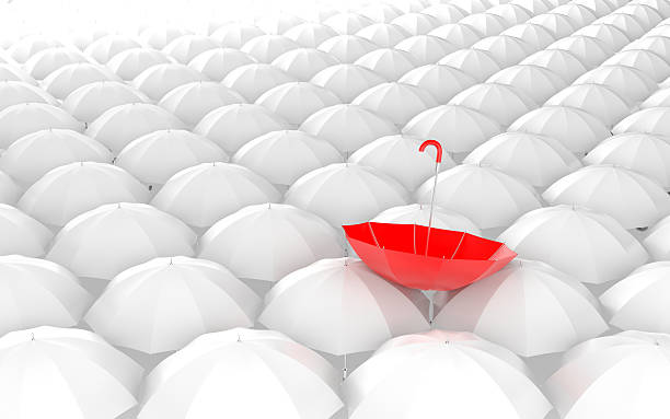 istock Standing out from the crowd. Umbrella metaphor 187683860
