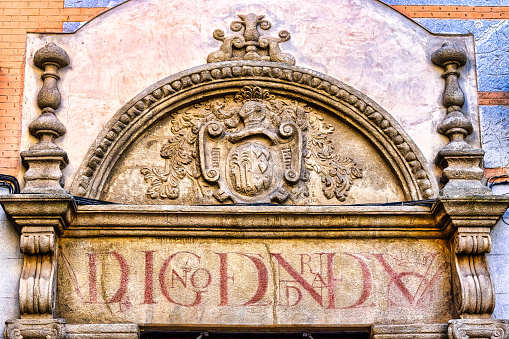 Toledo, Spain, decorative structure with a Latin inscription and a coat of arms