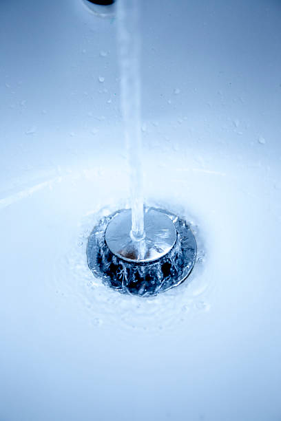 istock Streaming water in bathroom sink 187689850