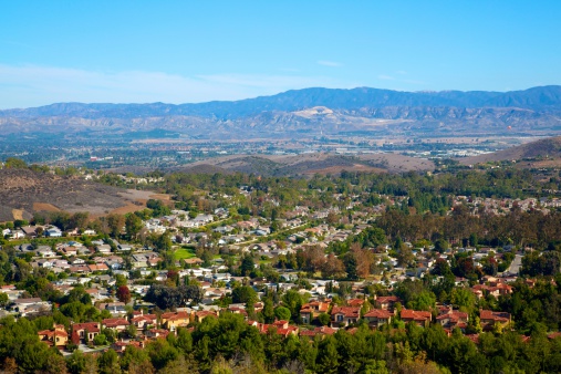 Aerial view of small city Poway in suburb of San Diego County, California, United States. Houses next the valley during dry season