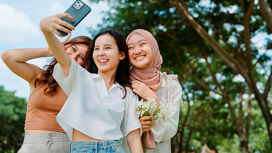 Friendship Frame: Capturing Joyful Moments with Diverse Female Companions in the Park