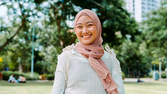 Portrait shot of Confidence Generation Z  Muslim woman smiling and looking at the camera
