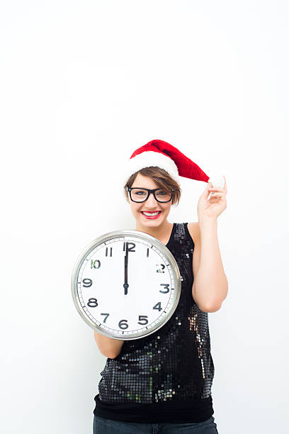istock Young woman with christmas hat and clock 187690655