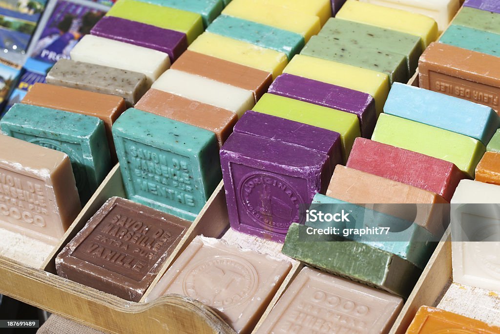 Different flavored  bars of soap different flavored and colored bars of soap on a farmer's market Marseille Stock Photo