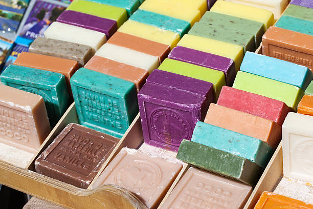 Different flavored  bars of soap different flavored and colored bars of soap on a farmer's market marseille stock pictures, royalty-free photos & images