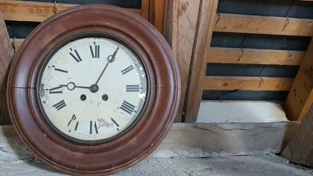 istock Broken antique clock with wooden frame and Roman numerals 1876918541