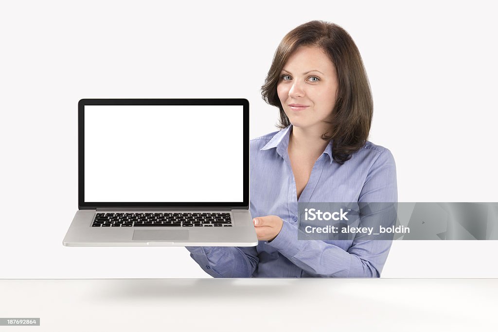 Biznes Kobieta trzyma laptopa - Zbiór zdjęć royalty-free (Biurko)