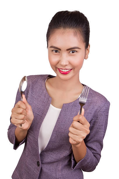 istock Beautiful woman holding a spoon and fork. 187694178
