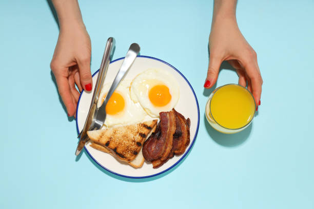 istock Fried bacon and egg - tasty breakfast, top view 1876973817