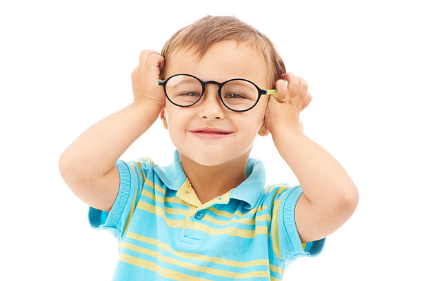 Liking my new specs! Studio portrait of a young boy wearing glasses isolated on white preschooler caucasian one person part of stock pictures, royalty-free photos & images