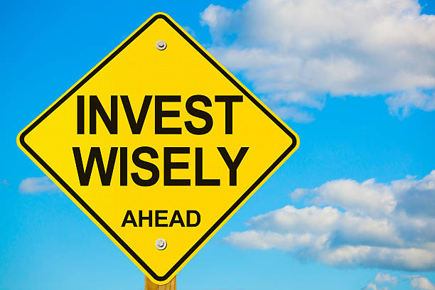 istock Invest Wisely Ahead Road Sign 187699267