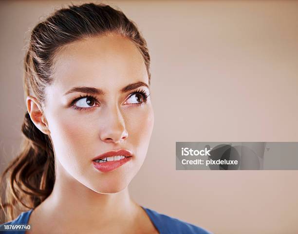 I Dont Know How To Answer That Stock Photo - Download Image Now - Biting Lip, Women, Brown Hair