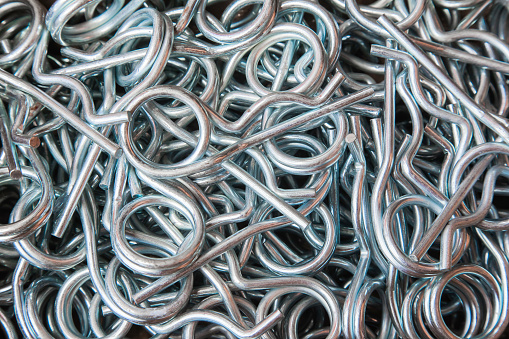 A pile of steel galvanized cotter pins, closeup.