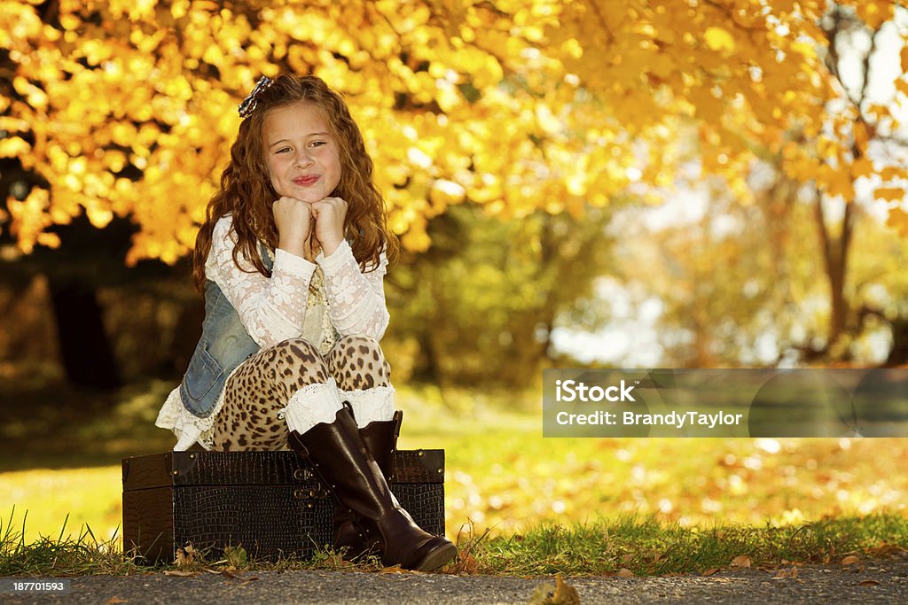 Autumn Adorable little girl on a beautiful fall day. 8-9 Years Stock Photo