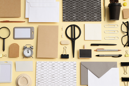 Mockup flat lay with different office accessories on beige background