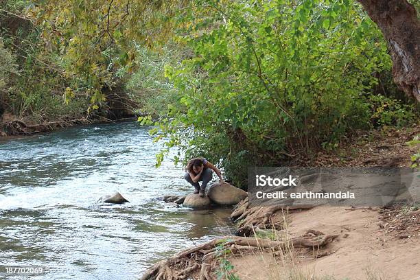 Israel Young Female On The Banks Of Snir Stream Stock Photo - Download Image Now - Adult, Adults Only, Adventure