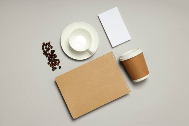 istock Mockup flat lay with different freelance accessories on light gray background 1877030323
