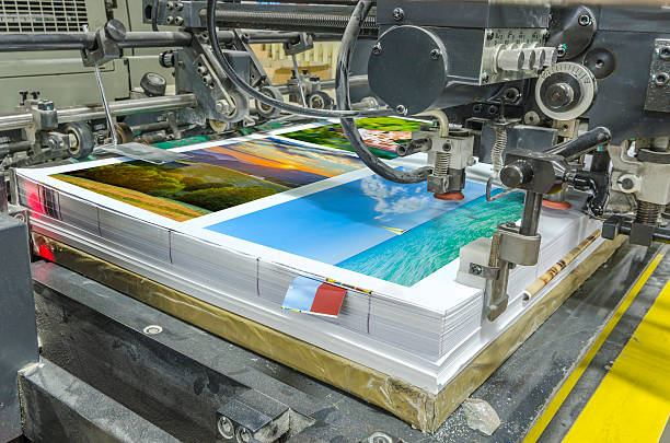 sheetfed paper feeder unit. Poster printing stock photo