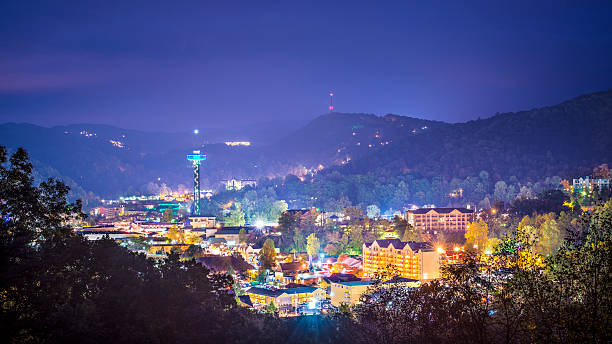 Town of Gatlinburg Tennessee lit up at night Gatlinburg, Tennessee in the Smoky Mountains. gatlinburg great smoky mountains national park north america tennessee stock pictures, royalty-free photos & images