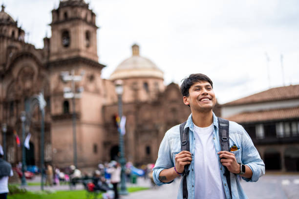 istock Cheerful young Hispanic man taking a walk in Plaza Mayor, Cusco, Peru 1877058137