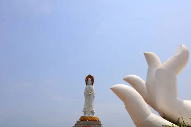 Sanya City, China - April 2, 2019: Guanyin sculpture on the sea in Nanshan tourist area, Sanya City, Hainan Province, China