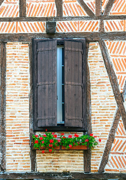 a closed wooden shutter on the wall of a house in germany