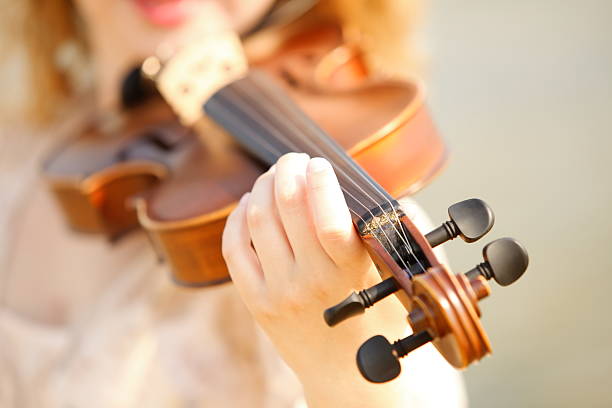 istock Female hand with a violin outdoor 187710863