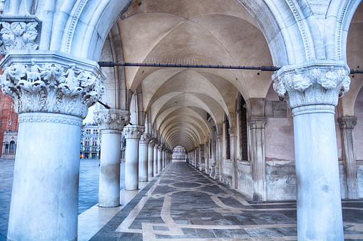 Exterior corridor of Doge's Palace at sunrise in Venice, Italy
