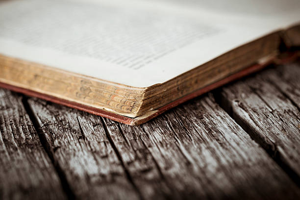 istock Antique book on wooden board 187713291