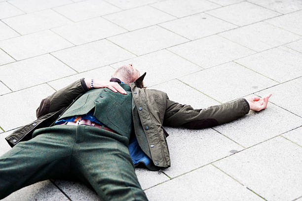 istock Mature man lying on the ground 187713589