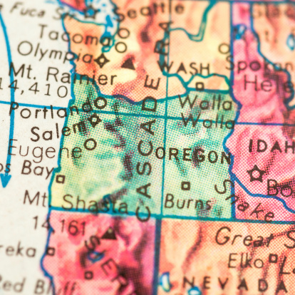 Studying Geography - Photograph of Oregon on retro globe. 