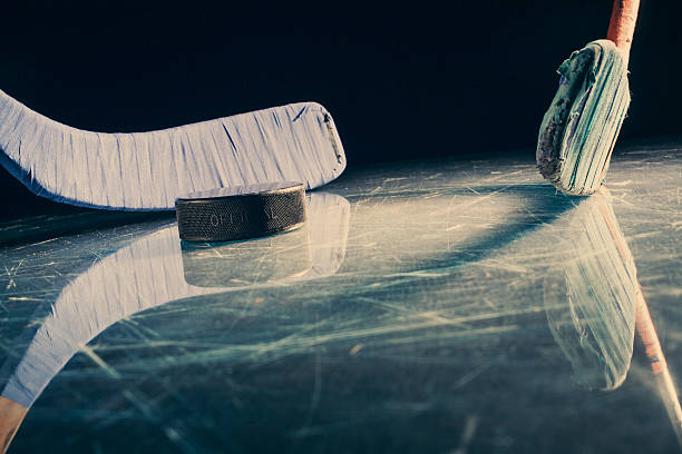 istock Hockey stick and puck 187715236