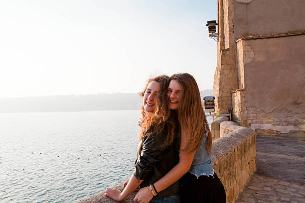 istock Two Teenager Embracing at Sunset 187715445
