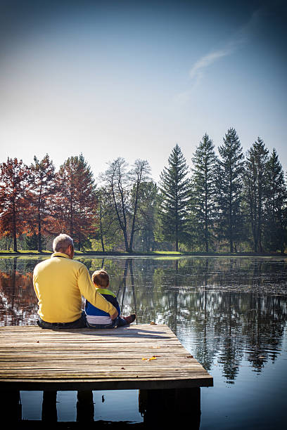 istock Father and son on the pier 187715492