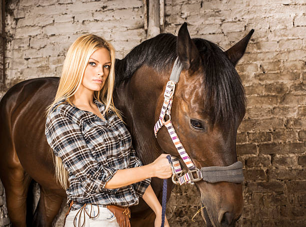 istock Young woman with her horse. 187716732
