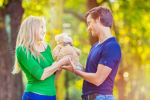 istock Young couple in love, receiving Valentine's gift 187718036