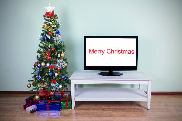 istock christmas tree with Big Screen TV 187718153
