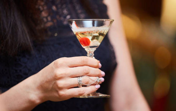 istock Alcoholic drink cocktail or champagne in women's hands. 1877181812