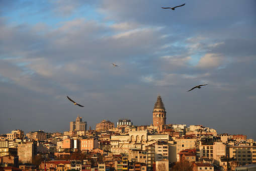 Istanbul, Turkey - December 12, 2023: Skyline of Istanbul with Galata Tower at sunset. This medieval stone tower is one of the city's most striking landmarks