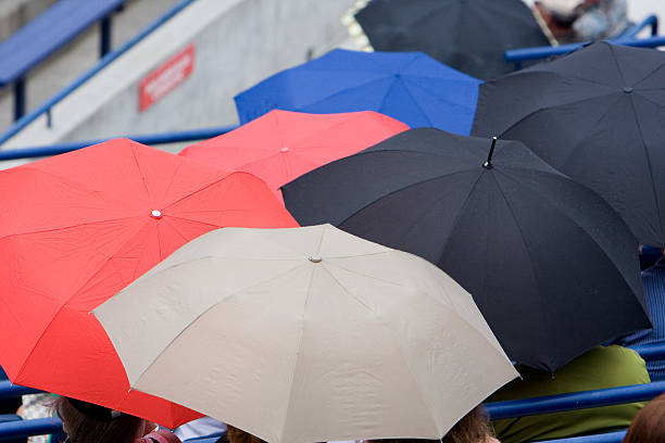 Umbrellas at the game stock photo