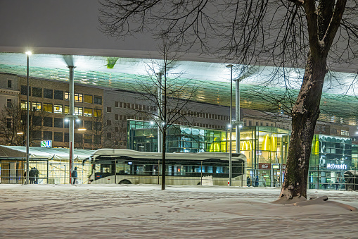 Steintorplatz, Hamburg, Germany - December 5th 2023:  Modern bus terminal at a winter night in the center of the city