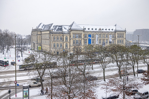 Steintorplatz, Hamburg, Germany - December 5th 2023:   View to a large old building which is home of the Kunst und Gewerbe Museum - Arts and Crafts Museum - on a snowy winters day