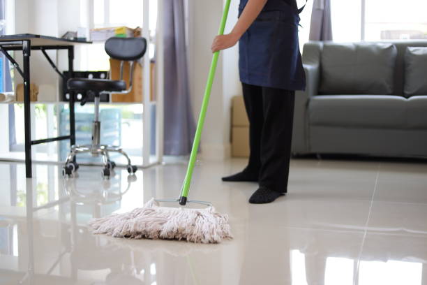 istock Cleaner is mopping floors at home with a mop. 1877219993